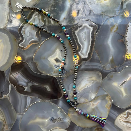 Larvikite, amethyst, and blue apatite mala beads with colorful tassel