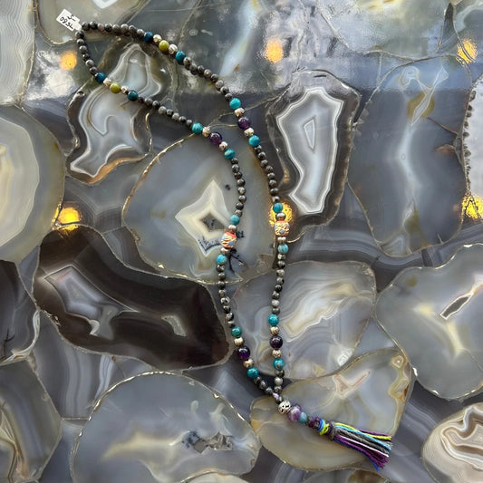 Larvikite, amethyst, and blue apatite mala beads with colorful tassel