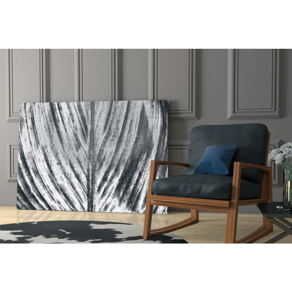 Modern wooden rocking chair with gray upholstery and blue cushion