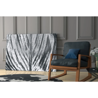 Modern wooden rocking chair with gray upholstery and blue cushion