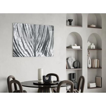 Bold abstract leaf glass wall art in black and white with silver metallic finish