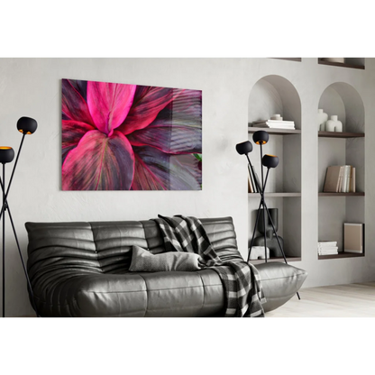 Vibrant pink purple leaf glass wall art print hanging on wall