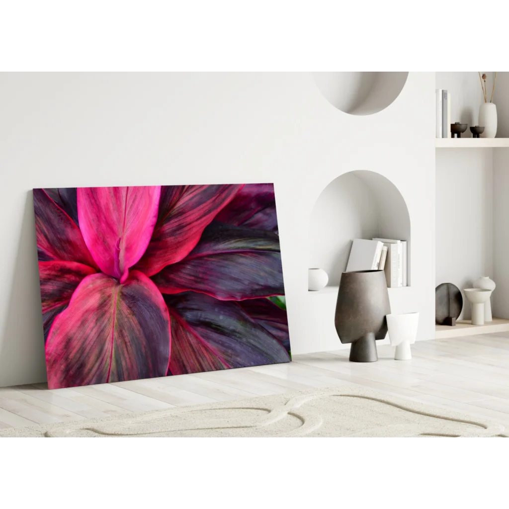 Vibrant pink purple leaf glass wall art print leaning on white wall