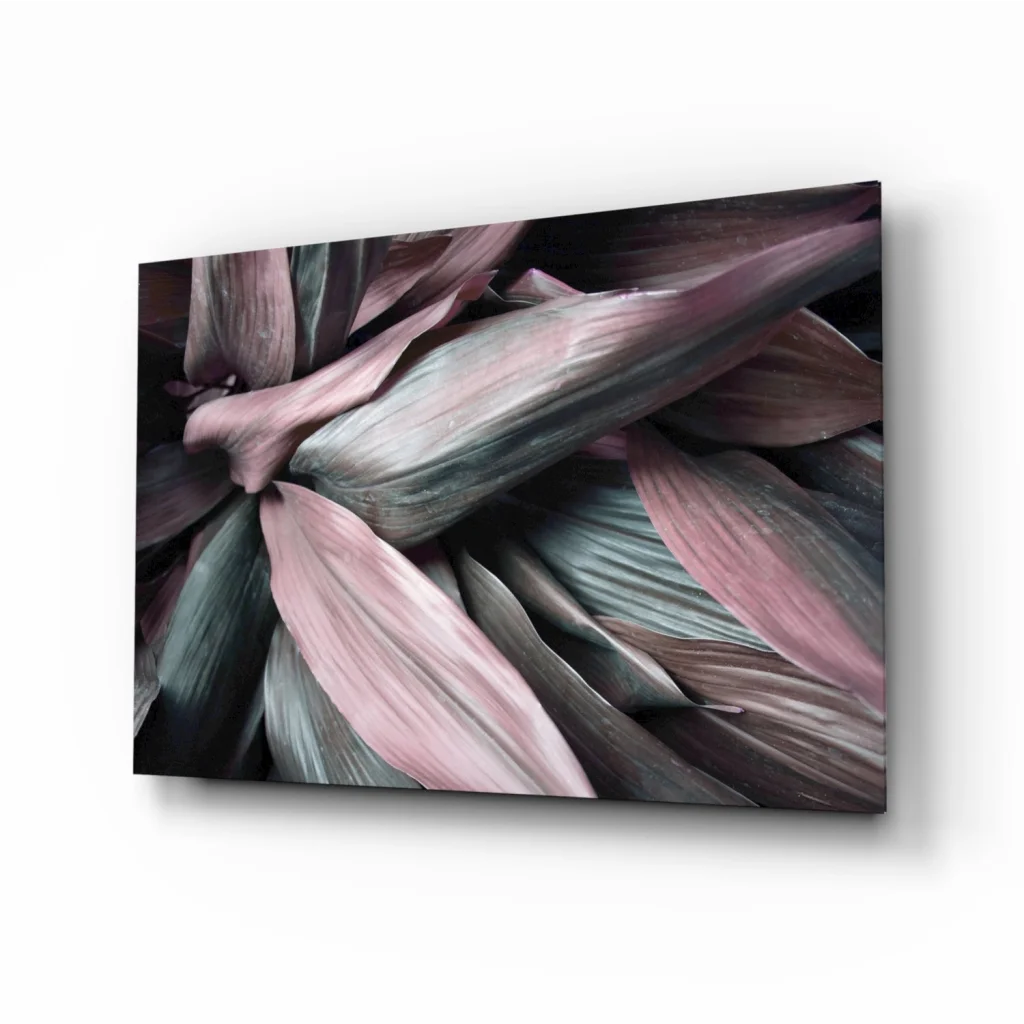 Layered leaves glass wall art with pink and teal overlapping foliage