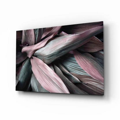 Layered leaves glass wall art with pink and teal overlapping foliage