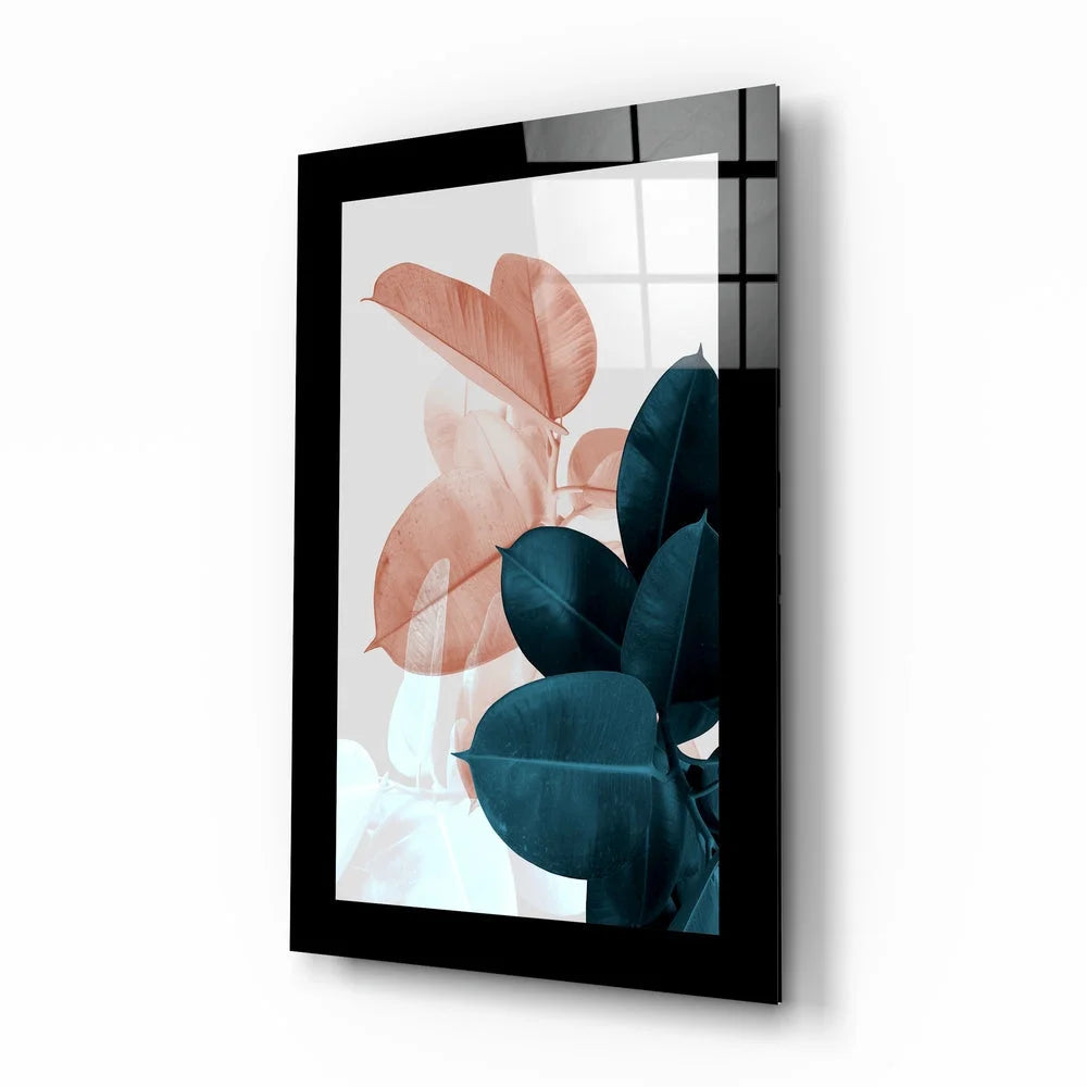 Modern botanical glass wall art with peach and teal leaves in black frame