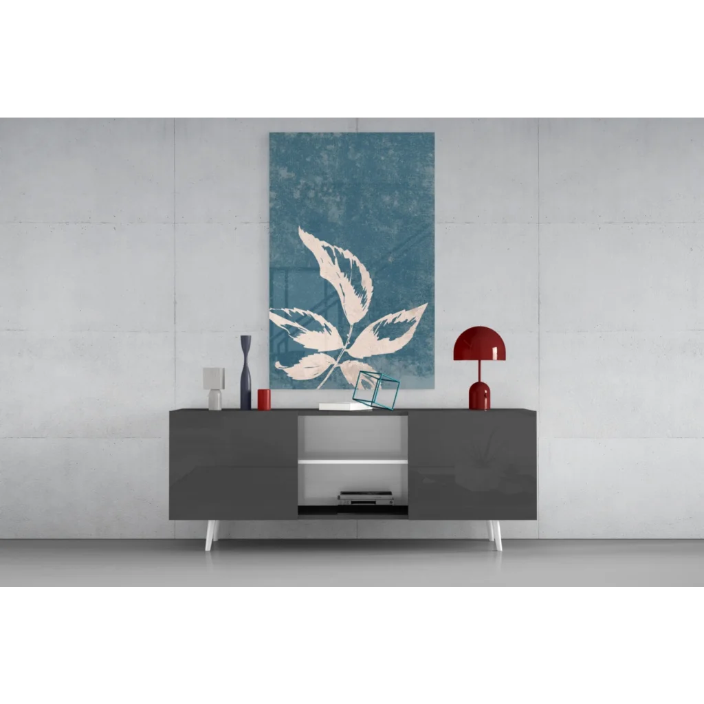 Modern gray sideboard with white legs and teal leaf wall art canvas print
