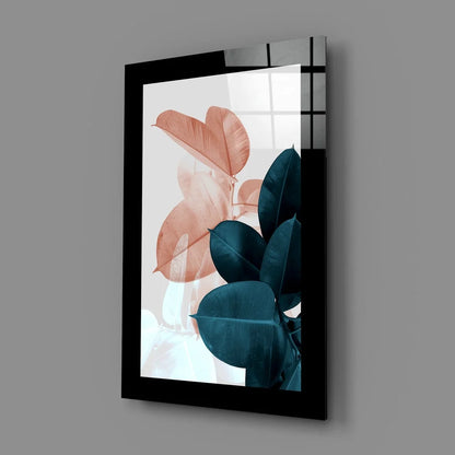 Modern botanical glass wall art with black-framed peach and teal leaves