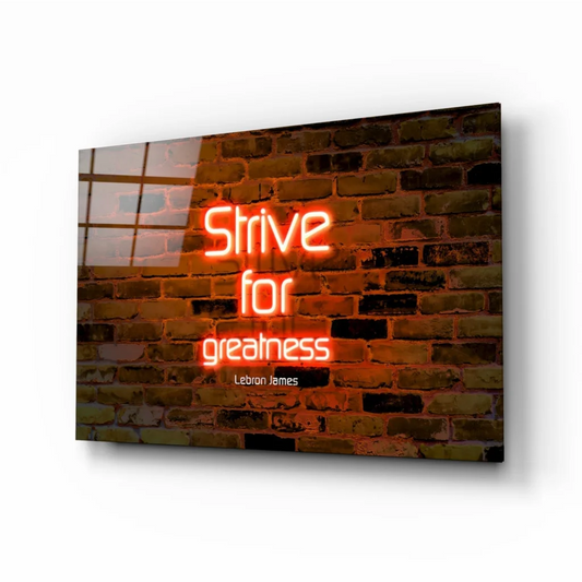 Neon orange LeBron James Strive for Greatness glass wall art on brick background