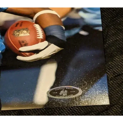 Football poster showing Lendale White Tennessee Titans autographed photo with COA sticker