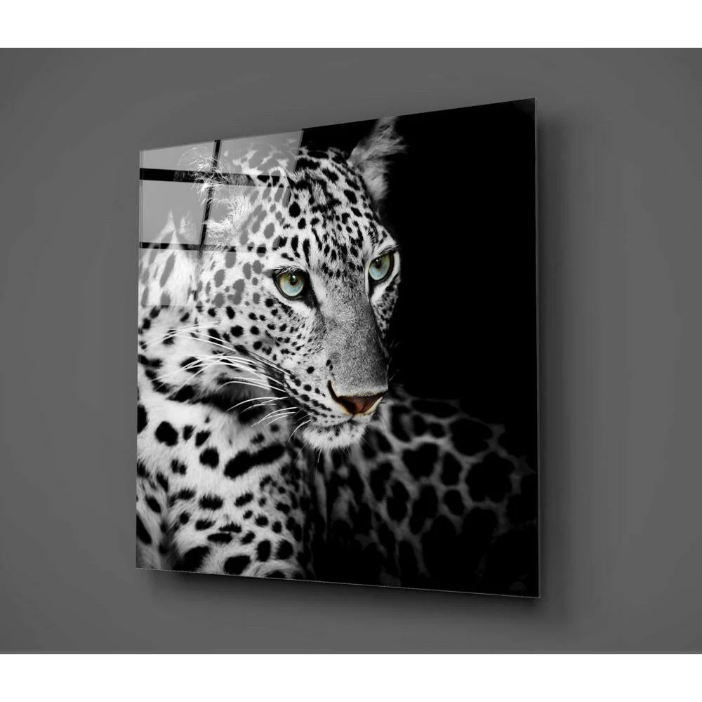 Stunning leopard glass wall art with piercing green eyes on acrylic panel