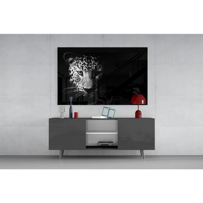 Black-and-white leopard portrait canvas wall art above gray console