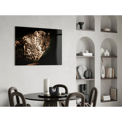 Striking black-and-gold leopard glass wall art on white wall