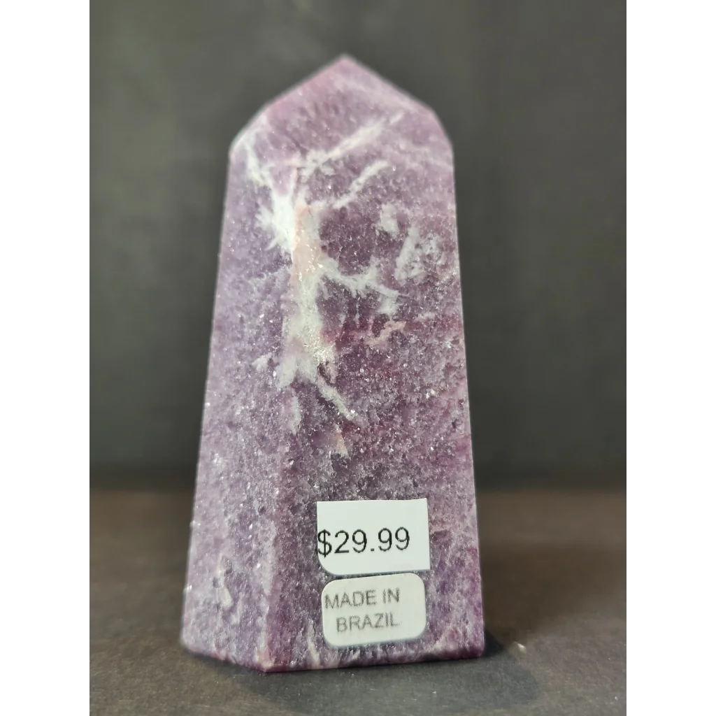 Lepidolite polished obelisk tower sculpture featuring a polished purple amethyst crystal point with white veining upright on base