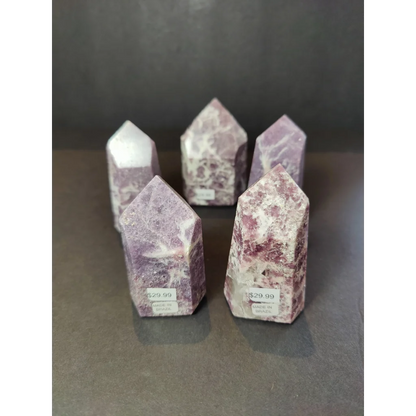 Lepidolite polished obelisk tower sculpture featuring purple and white marbled crystal point statues