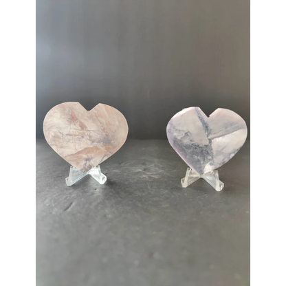Two heart-shaped quartz crystal slices in pinkish hue and clear gray veining for lepidolite tower and heart sculptures