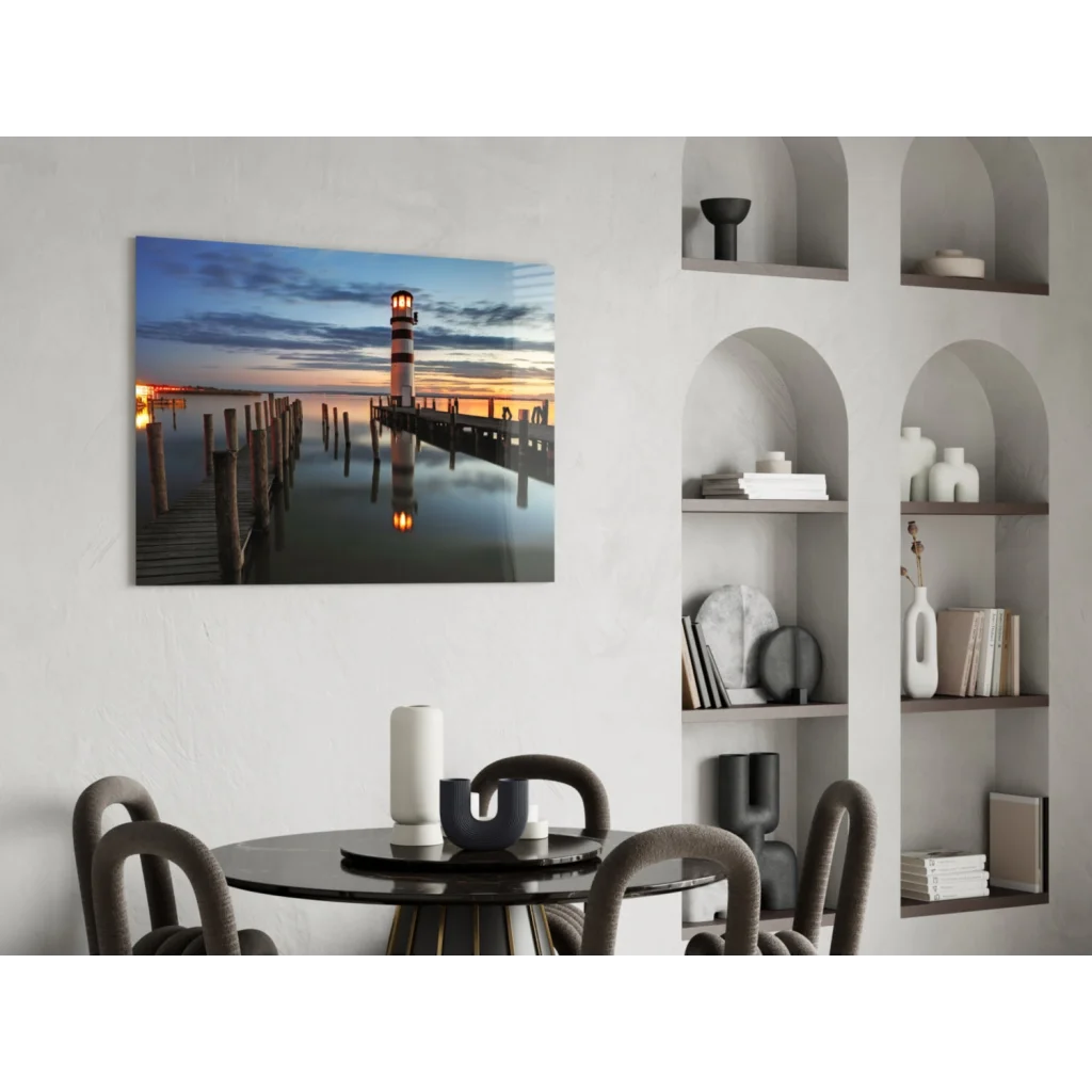 Lighthouse sunset glass wall art print at dusk on calm water