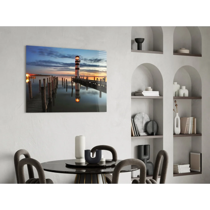 Lighthouse sunset glass wall art print at dusk on calm water