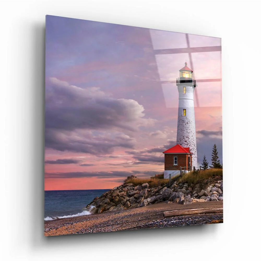 White lighthouse with red roof on rocky cliff in stunning glass wall art sunset sky