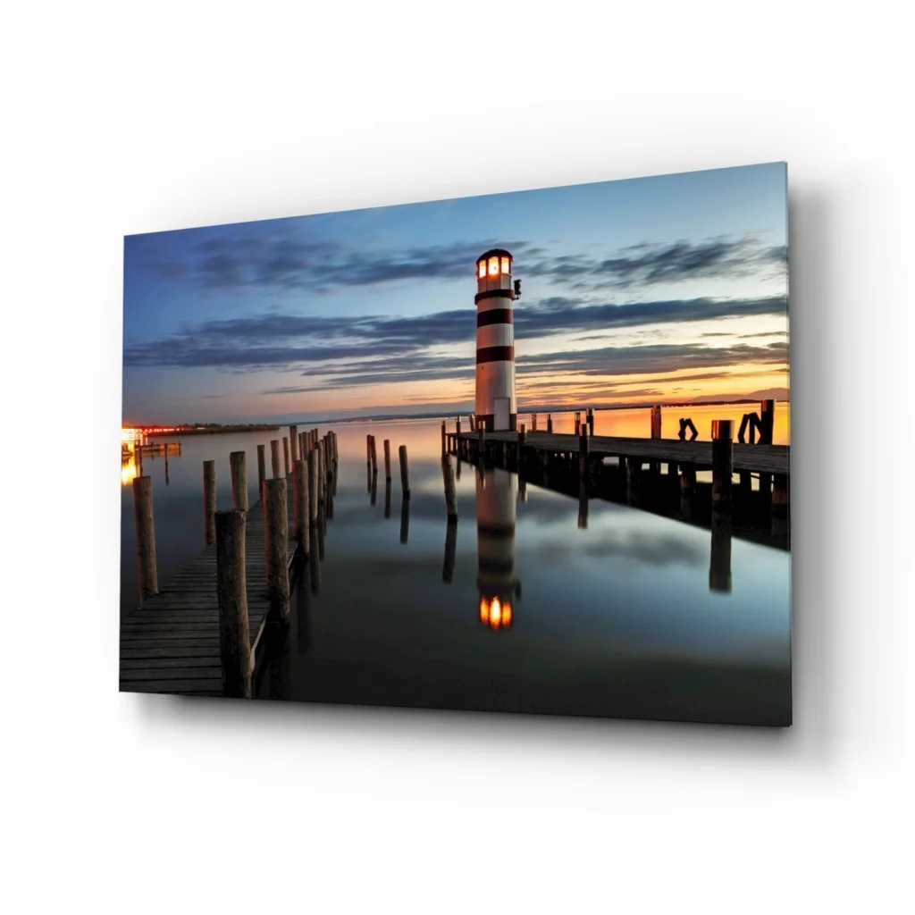 Serene lighthouse sunset glass wall art canvas print on pier