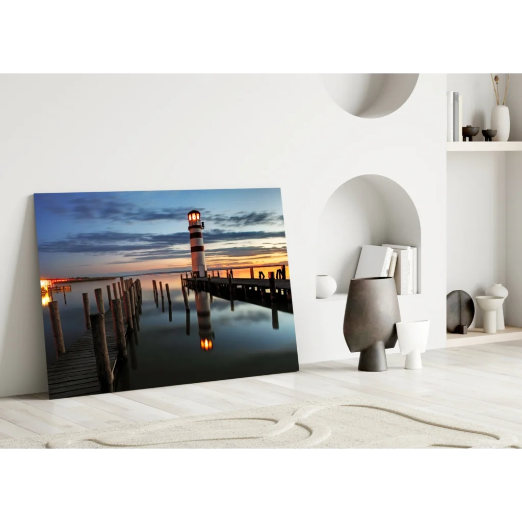 Lighthouse sunset glass wall art canvas print at dusk on calm water