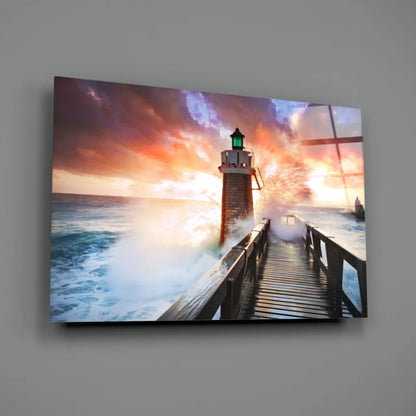 Vibrant lighthouse sunset glass wall art with glowing green lantern and crashing waves