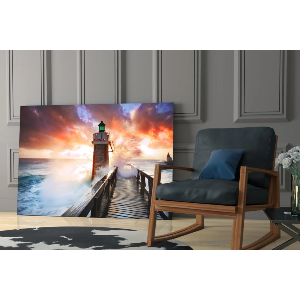 Vibrant lighthouse sunset glass wall art with orange waves and clouds