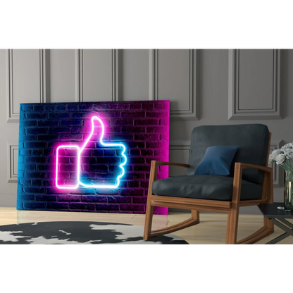 Vibrant neon pink and blue thumbs-up glass wall art on brick gradient