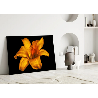 Vibrant yellow lily glass wall art on black canvas