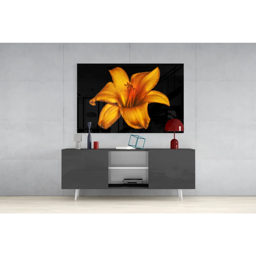Vibrant yellow lily glass wall art on glossy black canvas