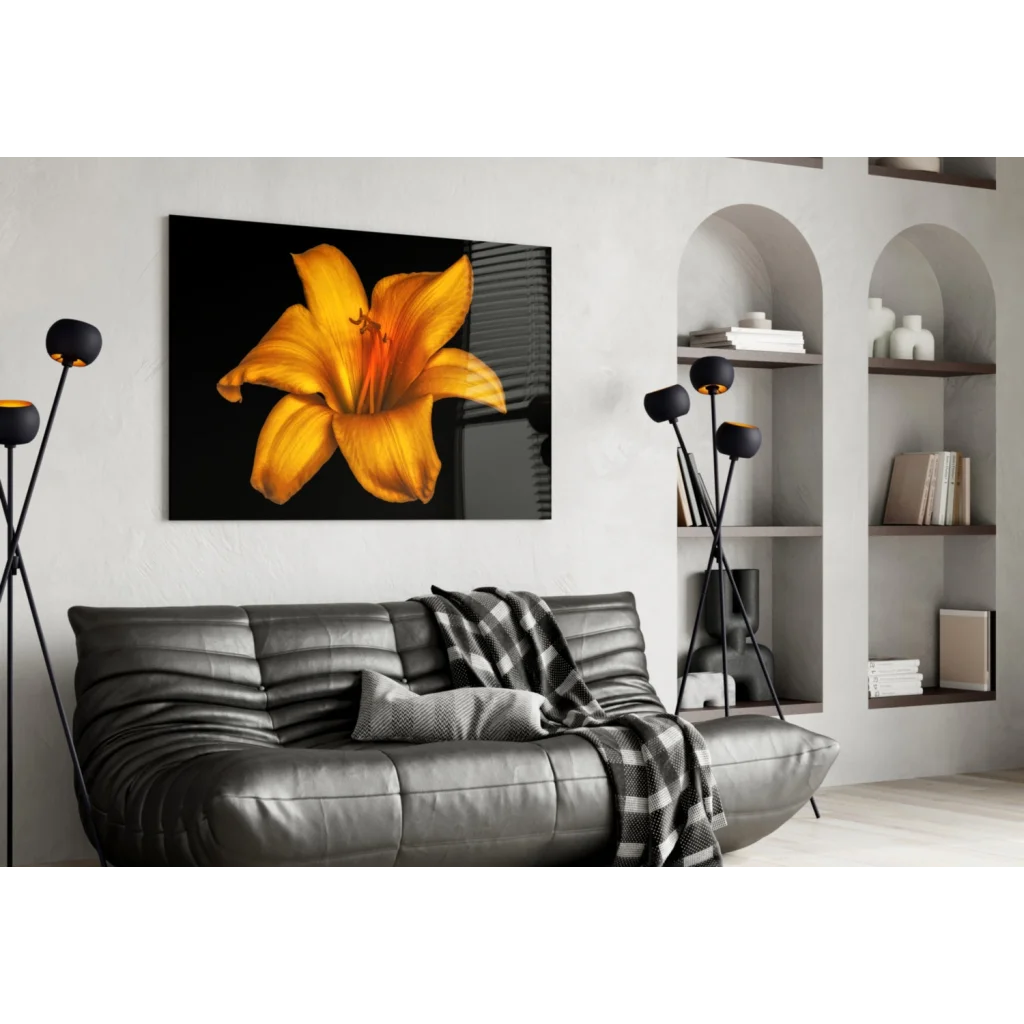 Vibrant yellow lily glass wall art on sleek black canvas