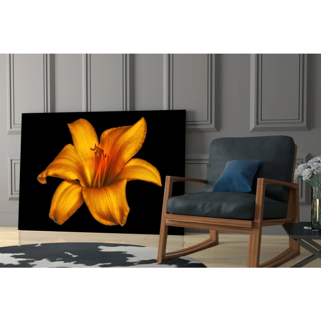 Vibrant yellow lily glass wall art on bold black canvas