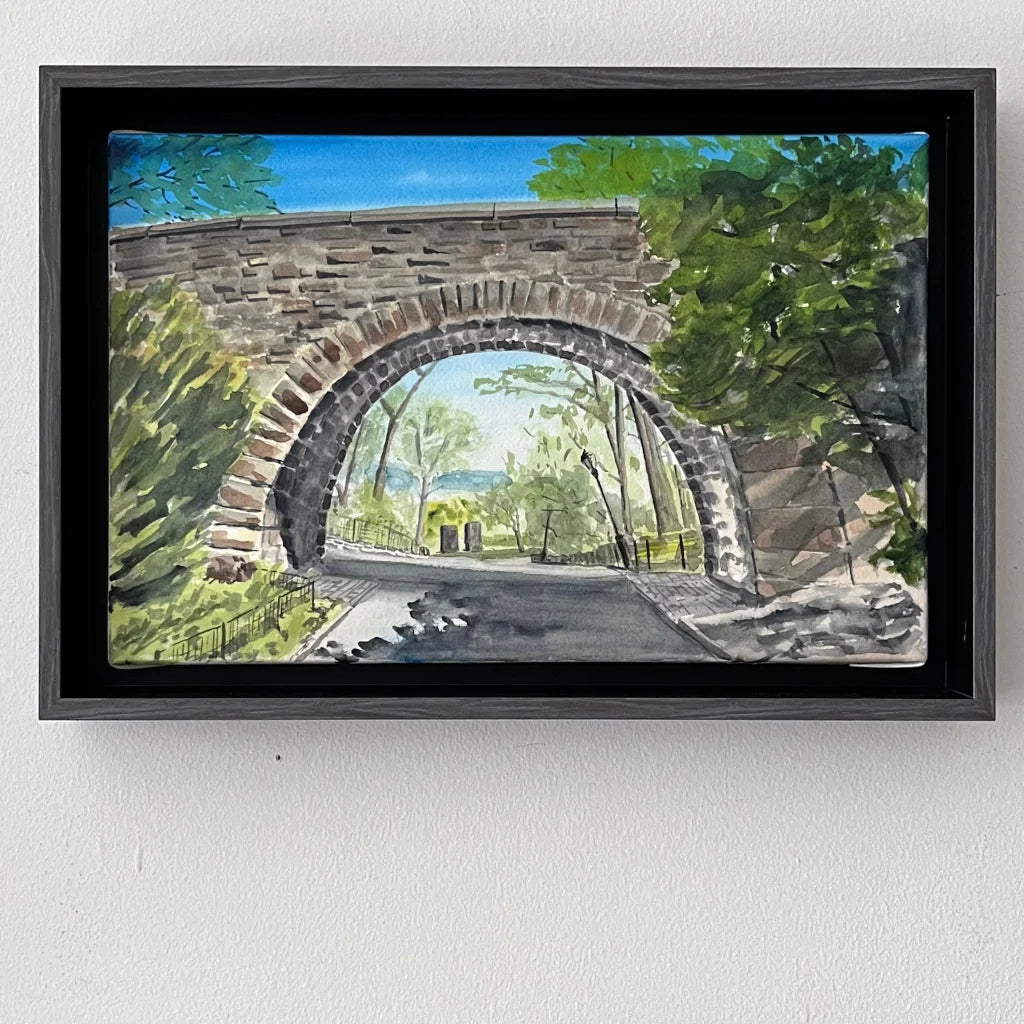 Linden Terrace Arch watercolor painting of black framed stone archway with green foliage and blue sky from Fort Tryon Park