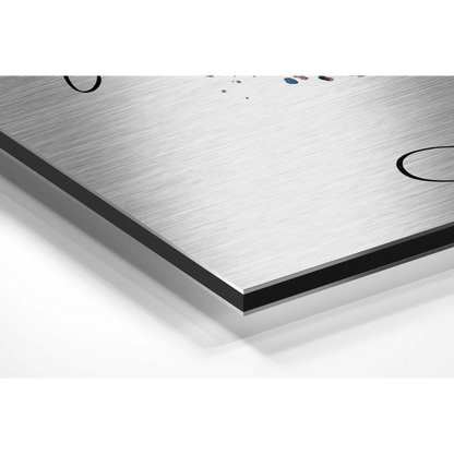 Stunning brushed aluminium dibond abstract face art with silver brushed metal, black circular accents, and subtle blue paint splatters