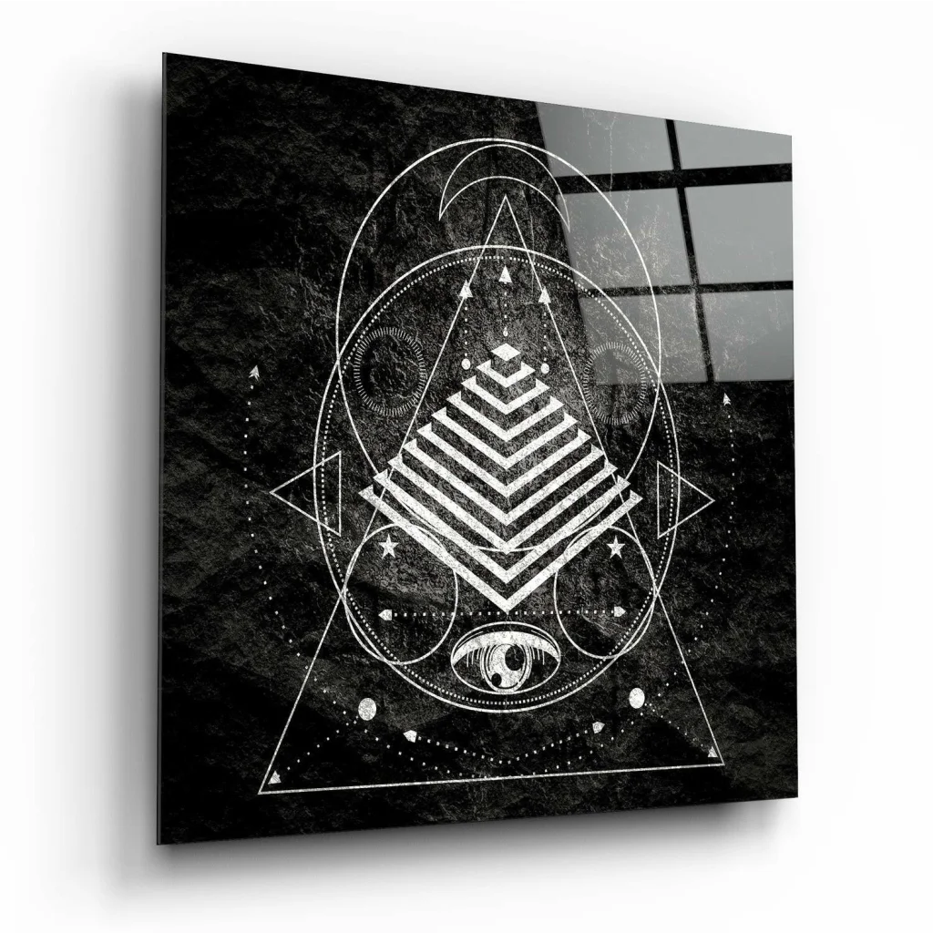 Stunning black glass wall art with white eye motif and triangular patterns
