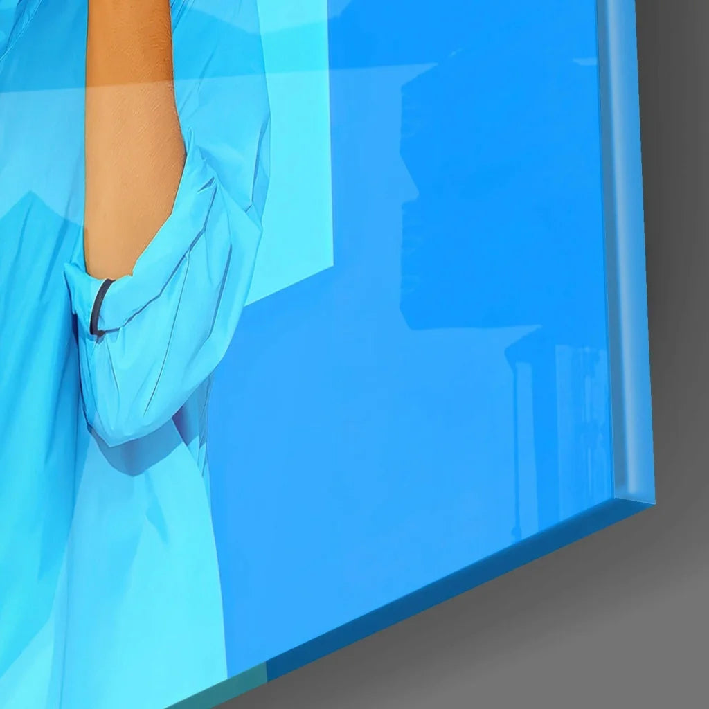 Vibrant blue glass wall art with stylized arm on glossy acrylic panel