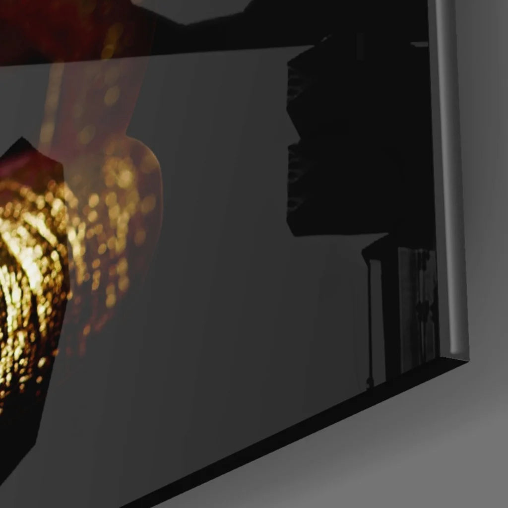 Glossy gold lips glass wall art with black frames and golden bokeh