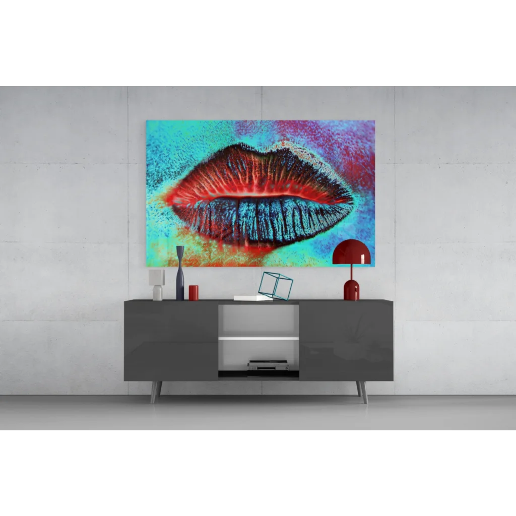 Bold pop art lips glass wall art with vibrant red blue lips on textured turquoise canvas