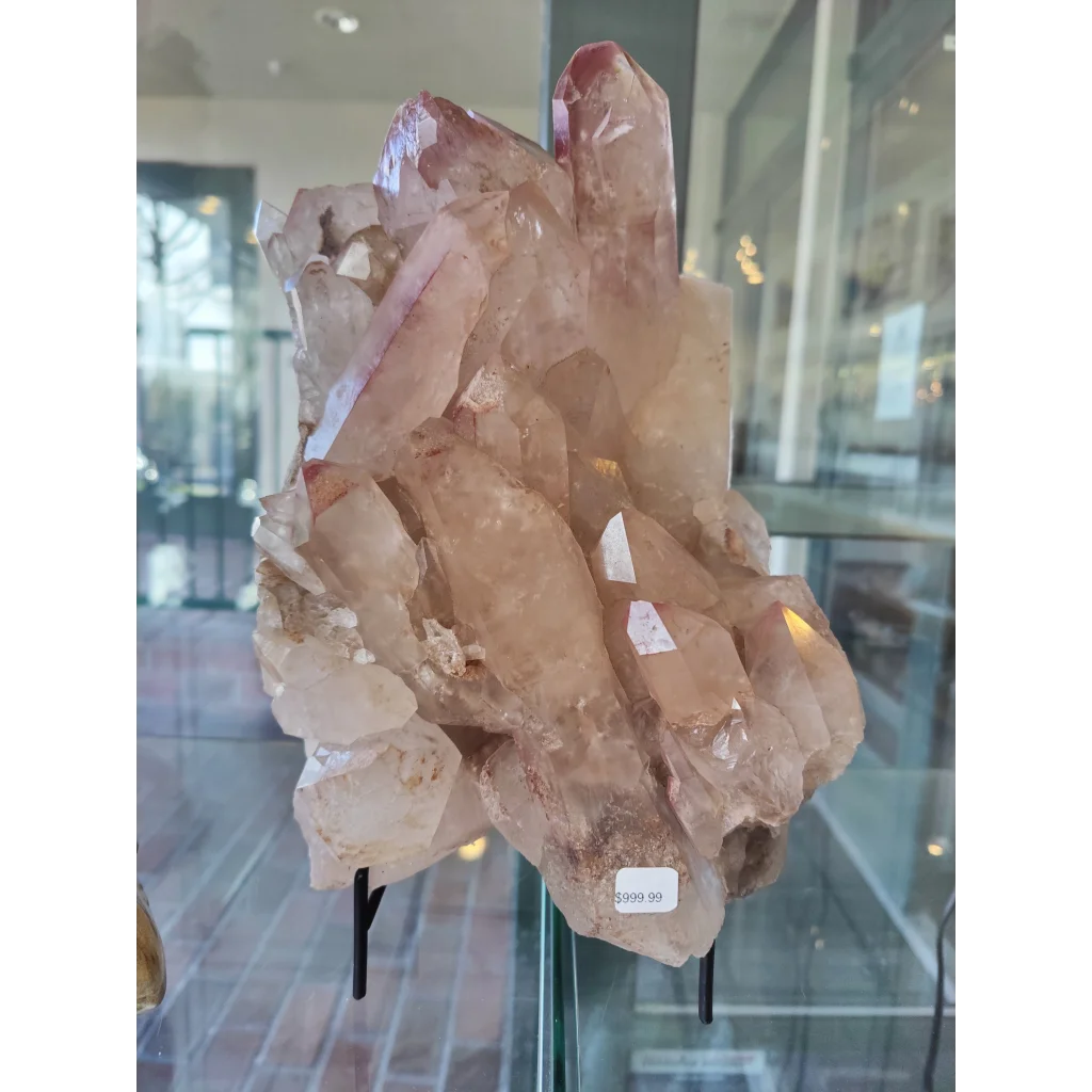Lithium quartz cluster 7.55kg with translucent pinkish-brown sharp interlocking facets and rugged texture