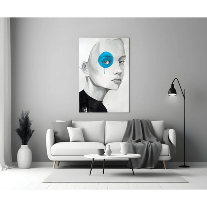 Striking black-and-white portrait wall art canvas with blue tear eye above sofa
