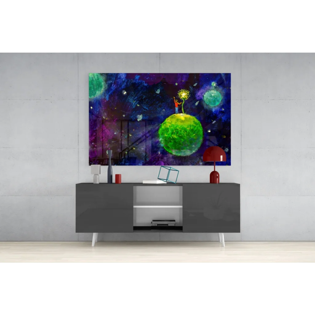 Vibrant green planet glass wall art with figure amid purple blue nebulae