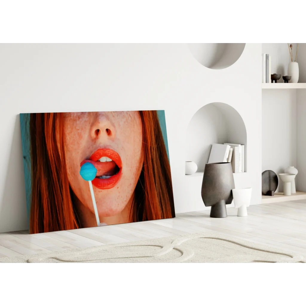 Vibrant pop art redhead glass wall art with blue lollipop canvas print