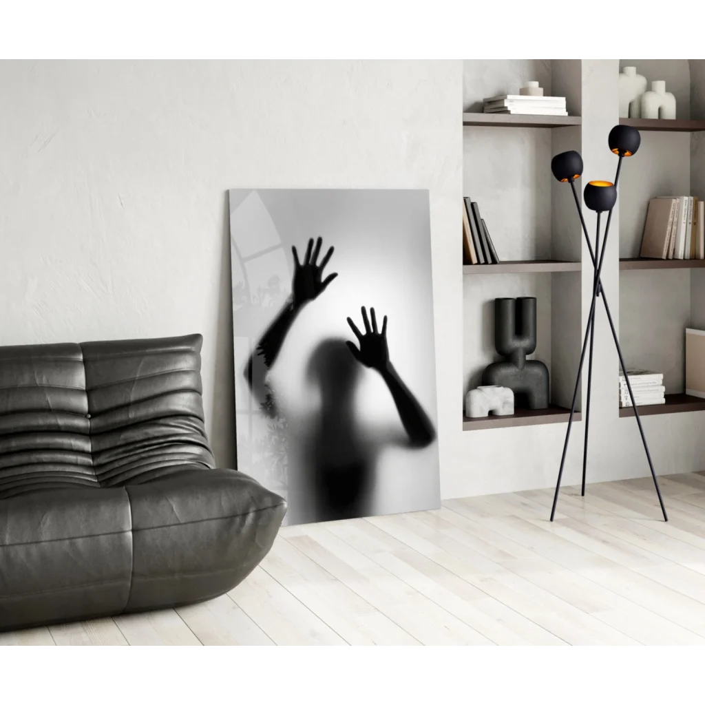 Black and white glass wall art print of silhouetted hands on frosted surface