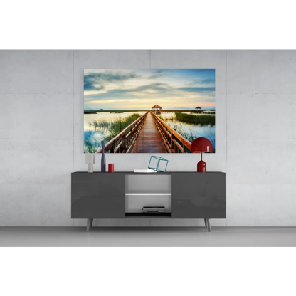 Tranquil boardwalk glass wall art over serene waters
