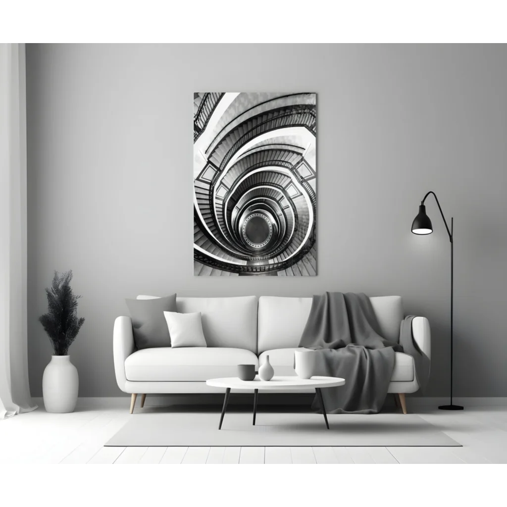 Black-and-white spiral staircase glass wall art print on gray wall above white sofa