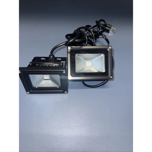Black rectangular purple LED floodlight with clear lens on power supply unit