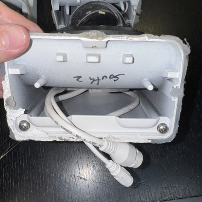 Lot includes white junction box labeled south 2 in Alarm.com home surveillance kit