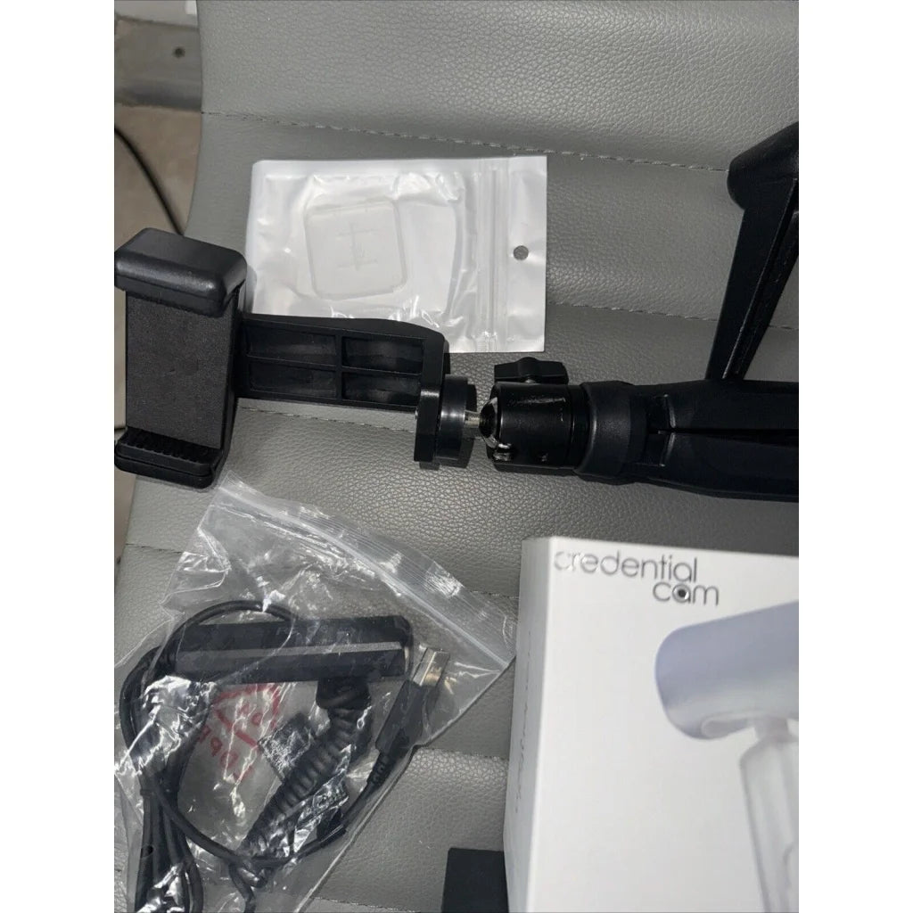 Black plastic car mount with adjustable clamp in lot offers of tripods
