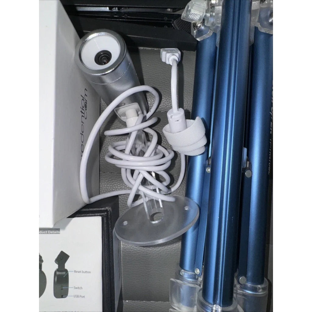 Silver cylindrical hair dryer in lot offers of cameras and tripods