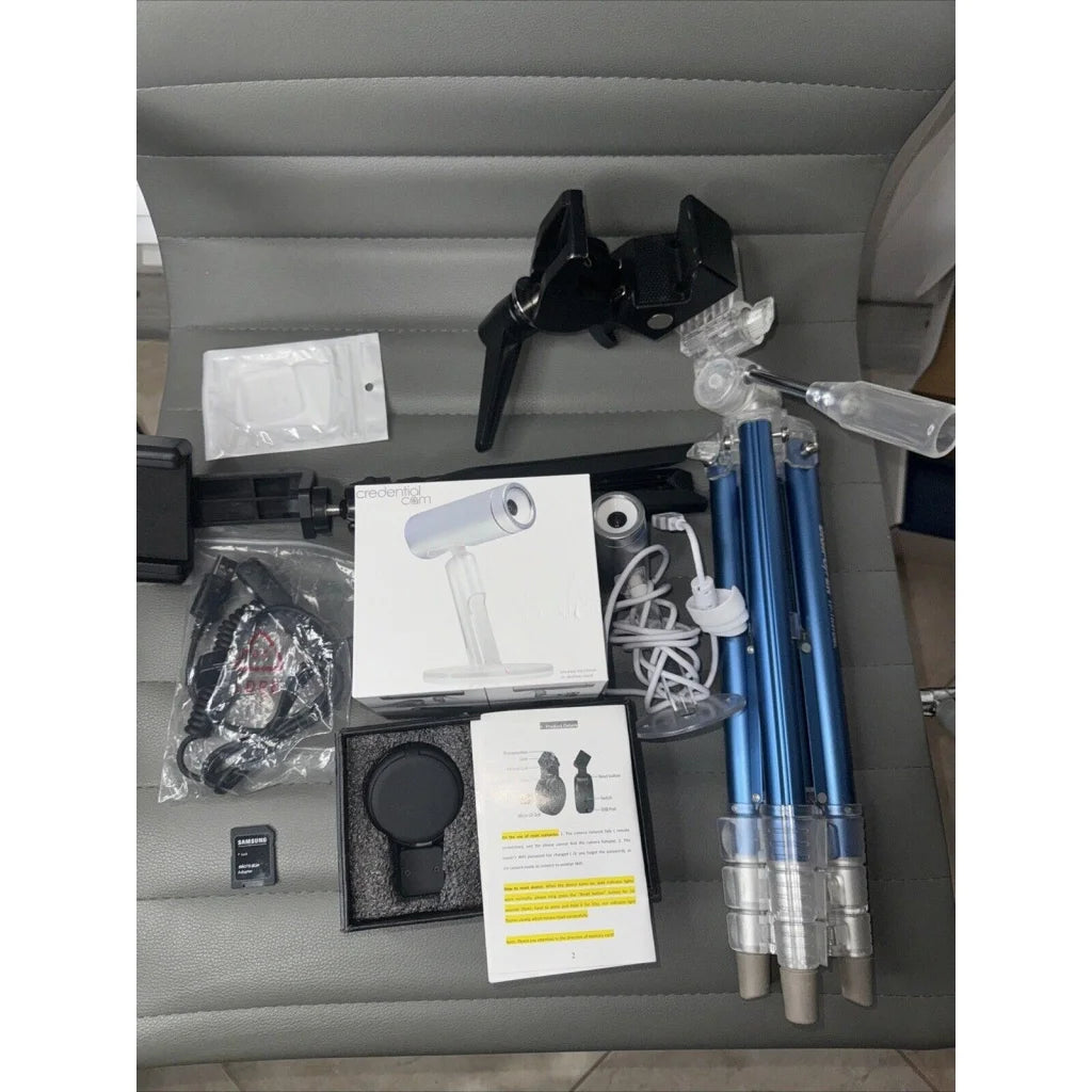 Sleek white silver webcam in lot offers of cameras and tripods